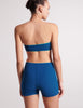 On model image of back of blue bandeau top and shorts 