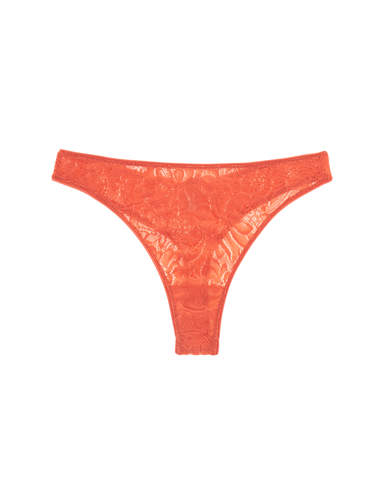 flat lay of orange lace thong